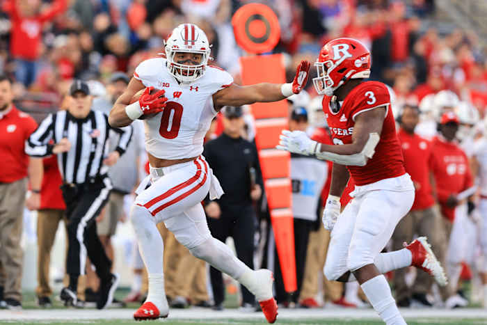 Wisconsin running back Braelon Allen stiff arms a Rutgers defender (Credit: Vincent Carchietta-USA TODAY Sports)